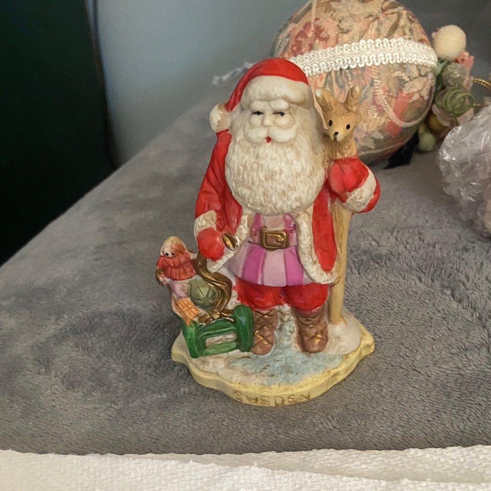 Festive Santa Claus Figurine with Reindeer - Red, White, and Purple